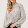 La Blouse à Motif Abstrait Blanc Et Noir